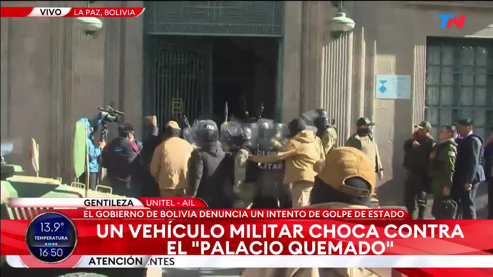 Bolivian military armoured vehicle breaks down the doors of the Palacio Quemado (former presidential residence) in La Paz and soldiers enter to secure the building